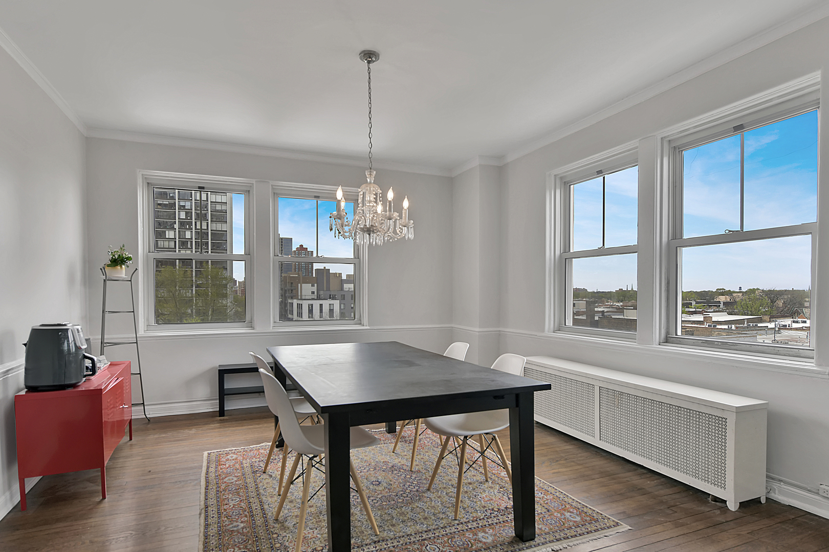 5555 North Sheridan Road, Unit 507 Chicago, IL 60640 - Photo 5 of 15 a workspace with furniture window and wooden floor