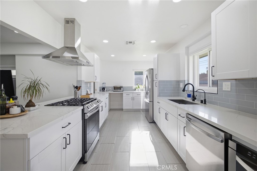 384 Colorado Street Arcadia, CA 91007 - Photo 20 of 51 a kitchen with stainless steel appliances a sink stove and cabinets