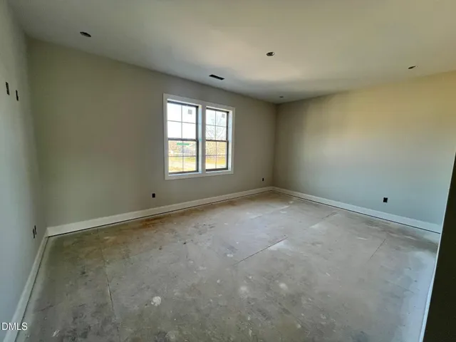 a living room with furniture kitchen and a chandelier
