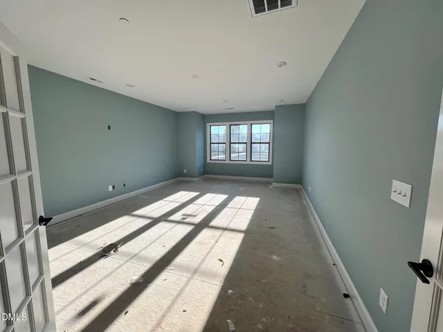 a living room with furniture kitchen and a chandelier