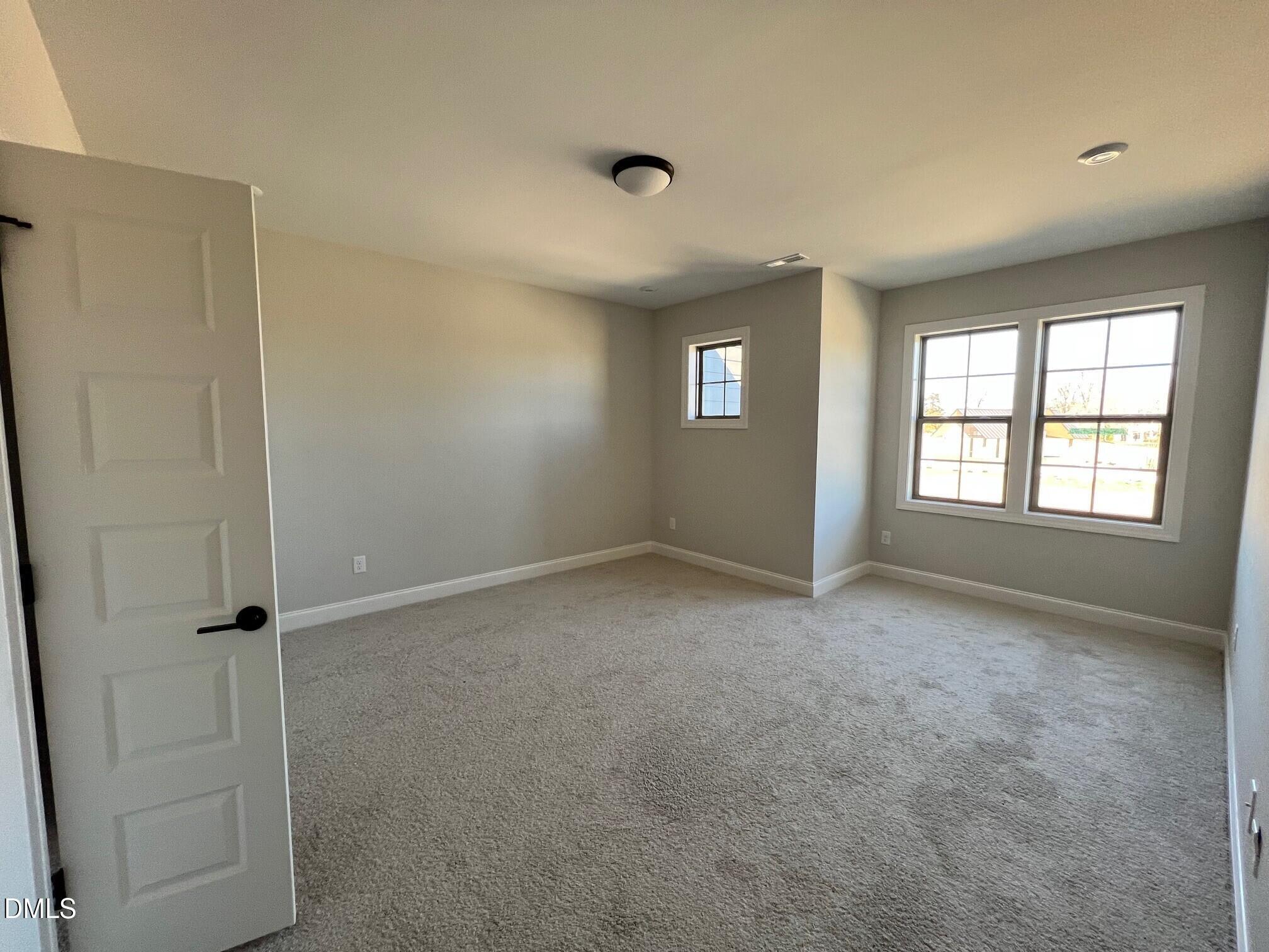 1003 Coldspring Circle Durham, NC 27705 - Photo 20 of 24 an empty room with windows and closet