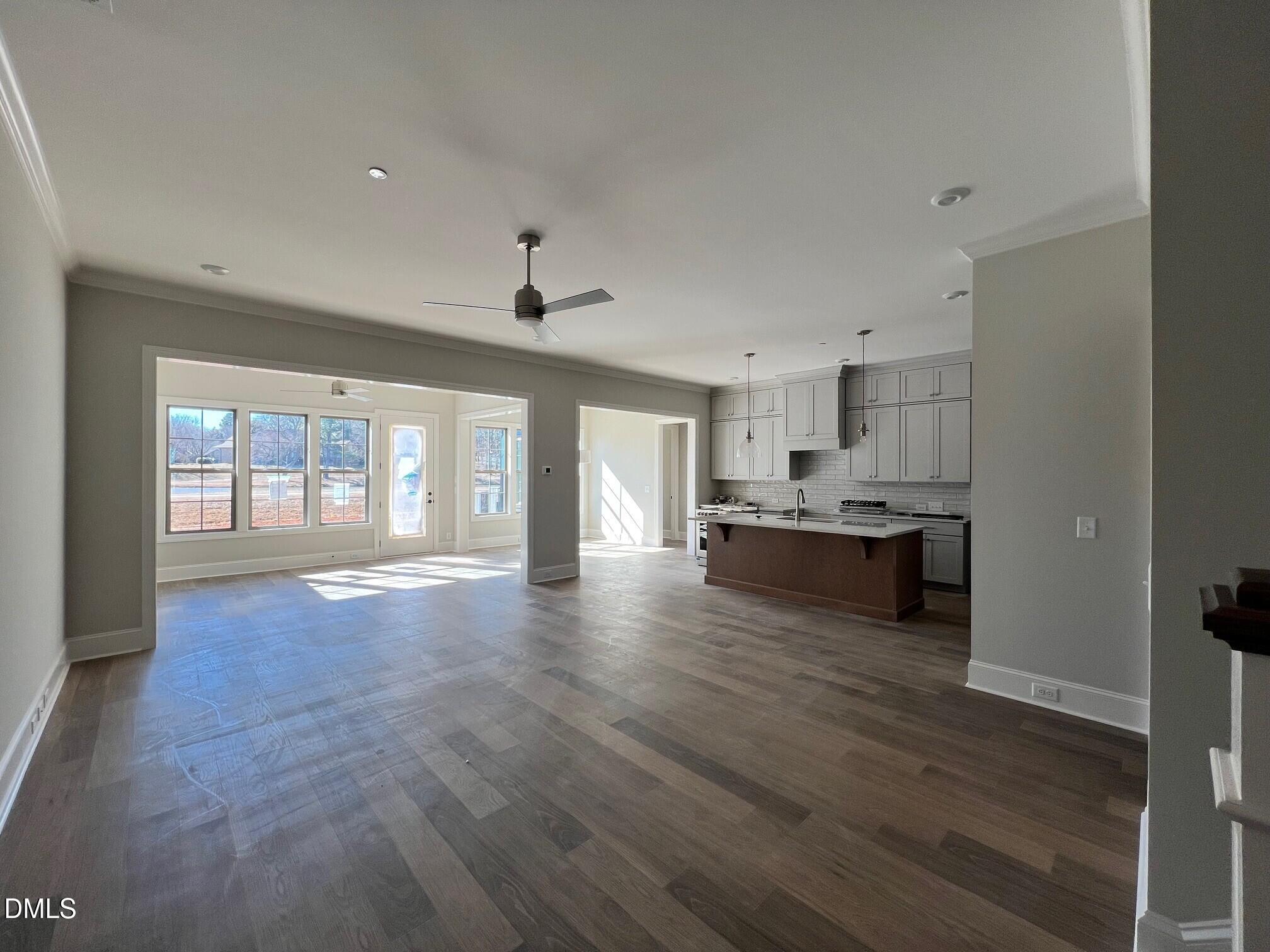 1003 Coldspring Circle Durham, NC 27705 - Photo 3 of 24 a view of an empty room with window and wooden floor