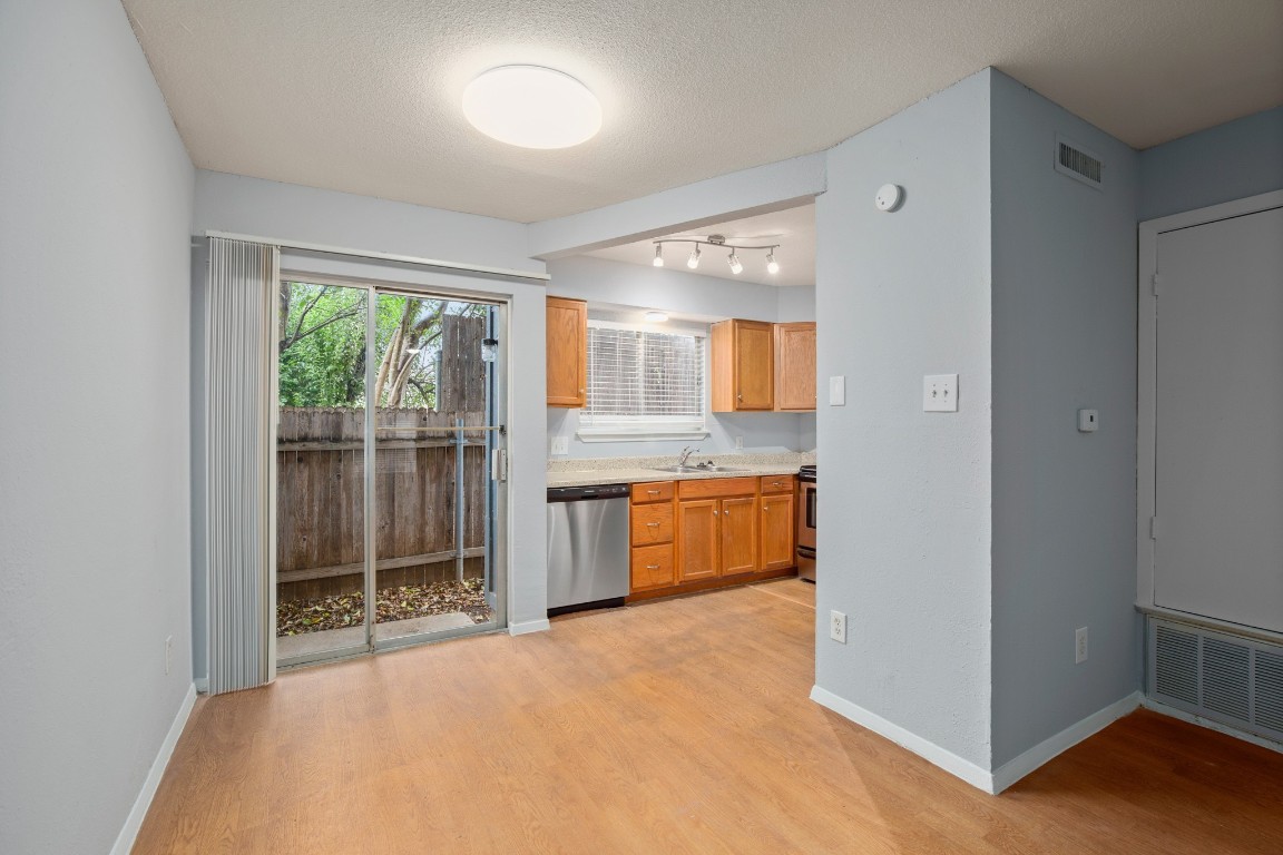 3415 Menchaca Road, Unit 101 Austin, TX 78704 - Photo 4 of 14 a large white kitchen with a large window
