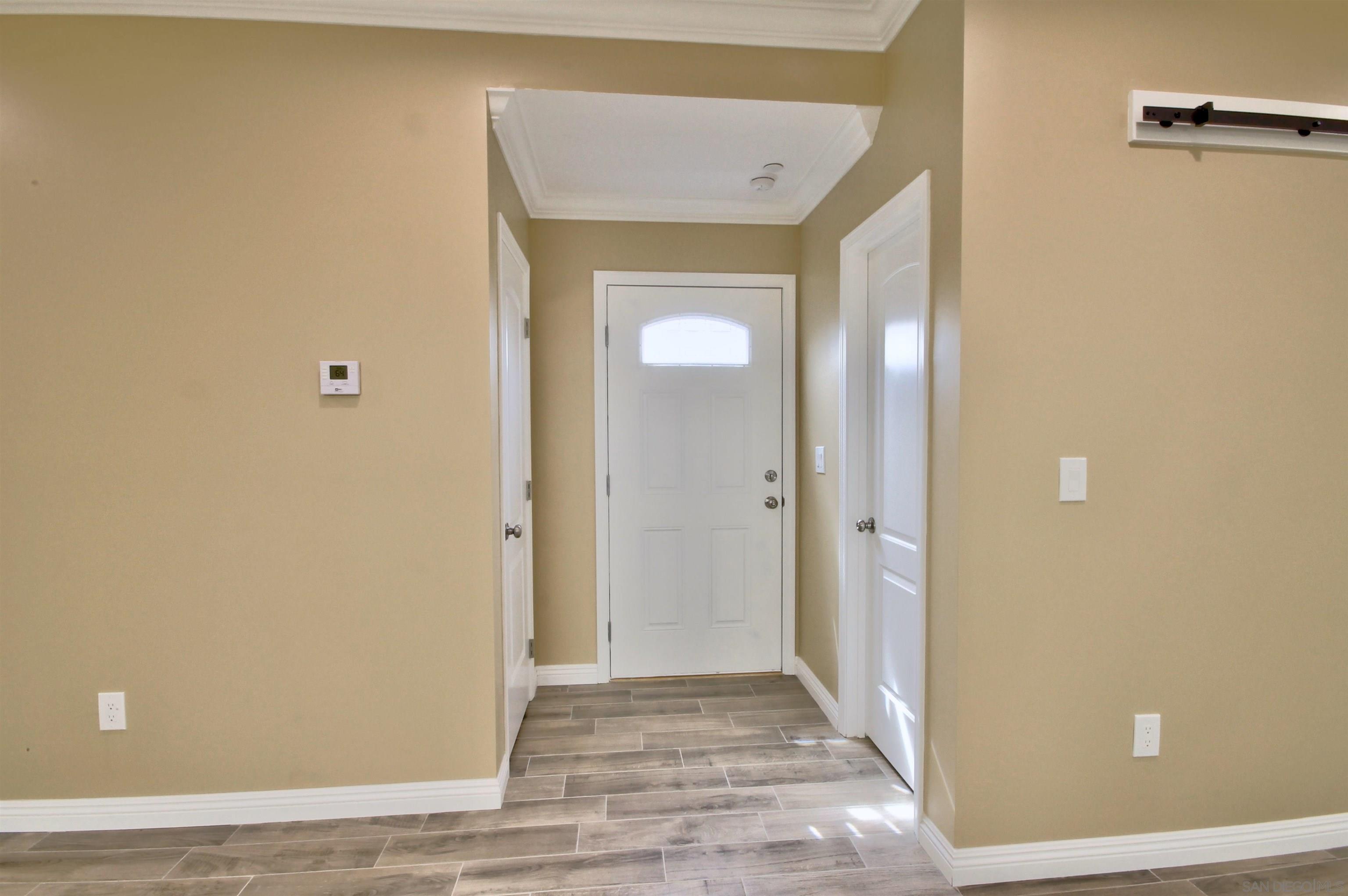 903 Concepcion Avenue Spring Valley, CA 91977 - Photo 35 of 41 a view of a hallway with wooden floor