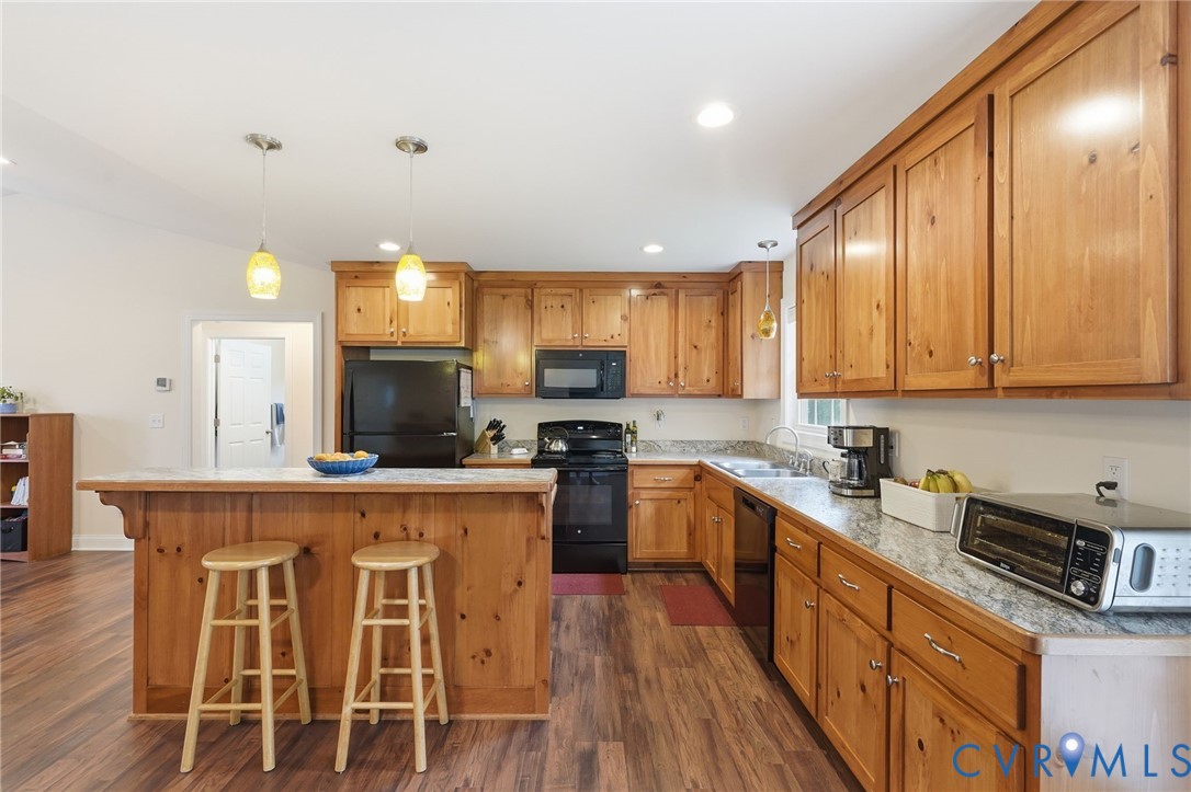 4937 Hurop Road Sandston, VA 23150 - Photo 21 of 55 Warm wood cabinetry and a spacious island with sea