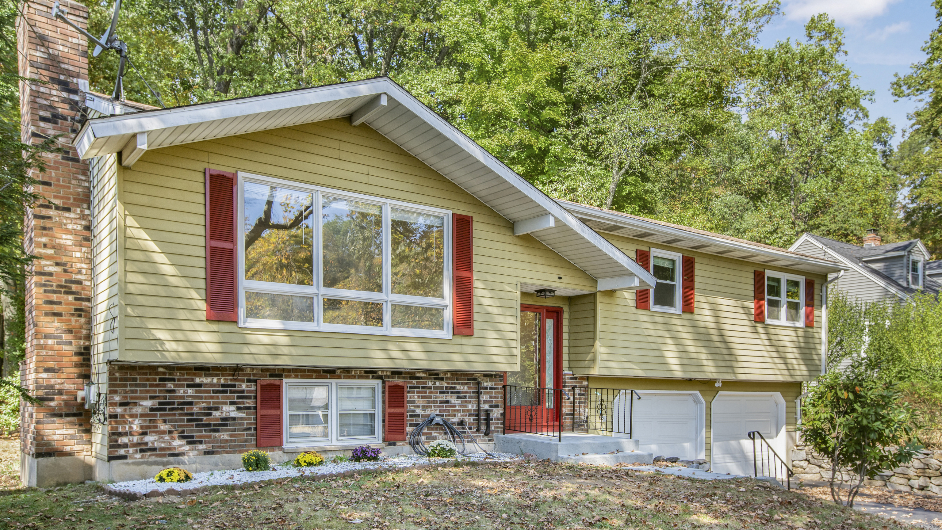 a front view of a house with garden