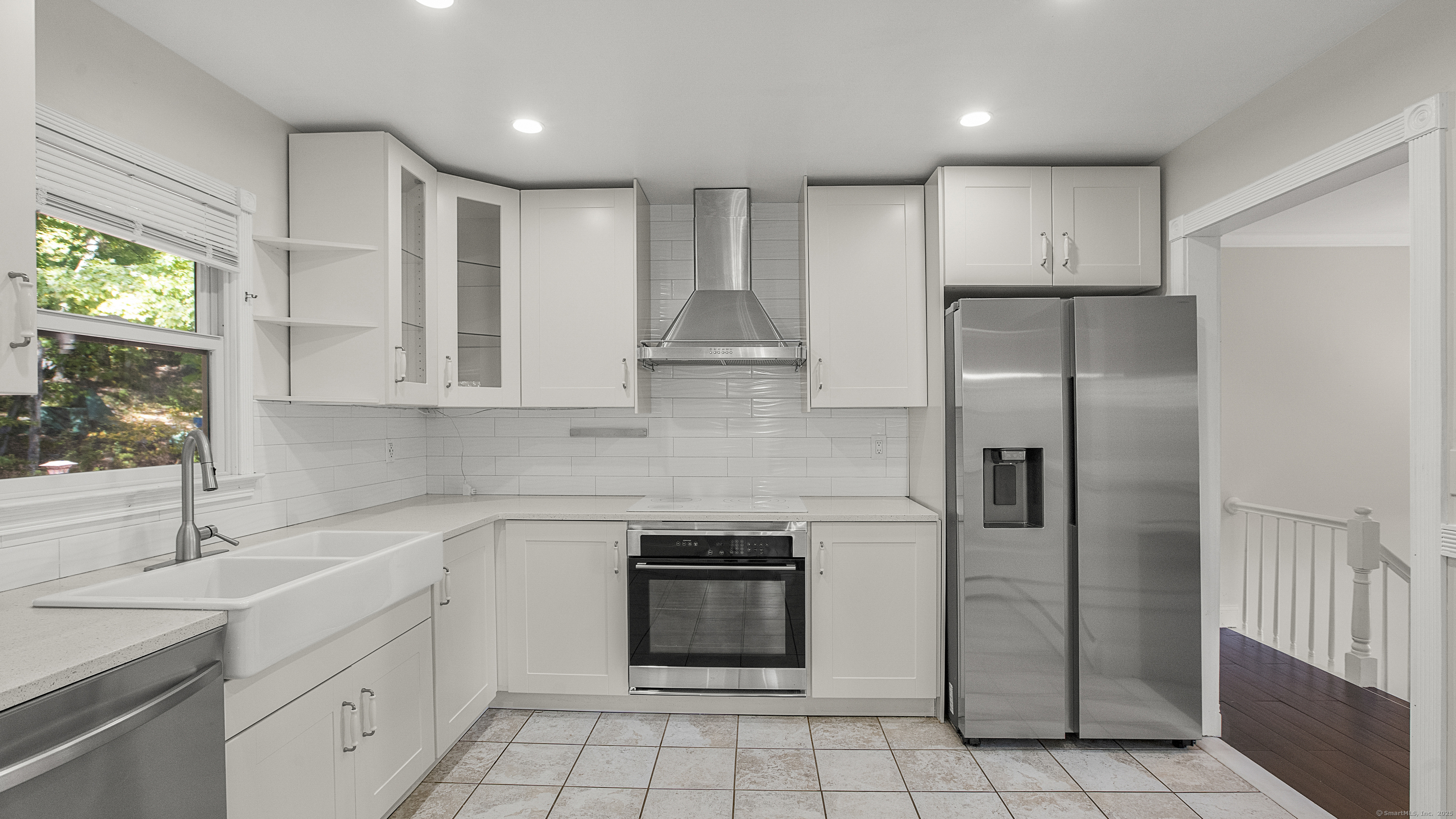 739 Field Street Naugatuck, CT 06770 - Photo 6 of 14 a kitchen with a sink stainless steel appliances and cabinets