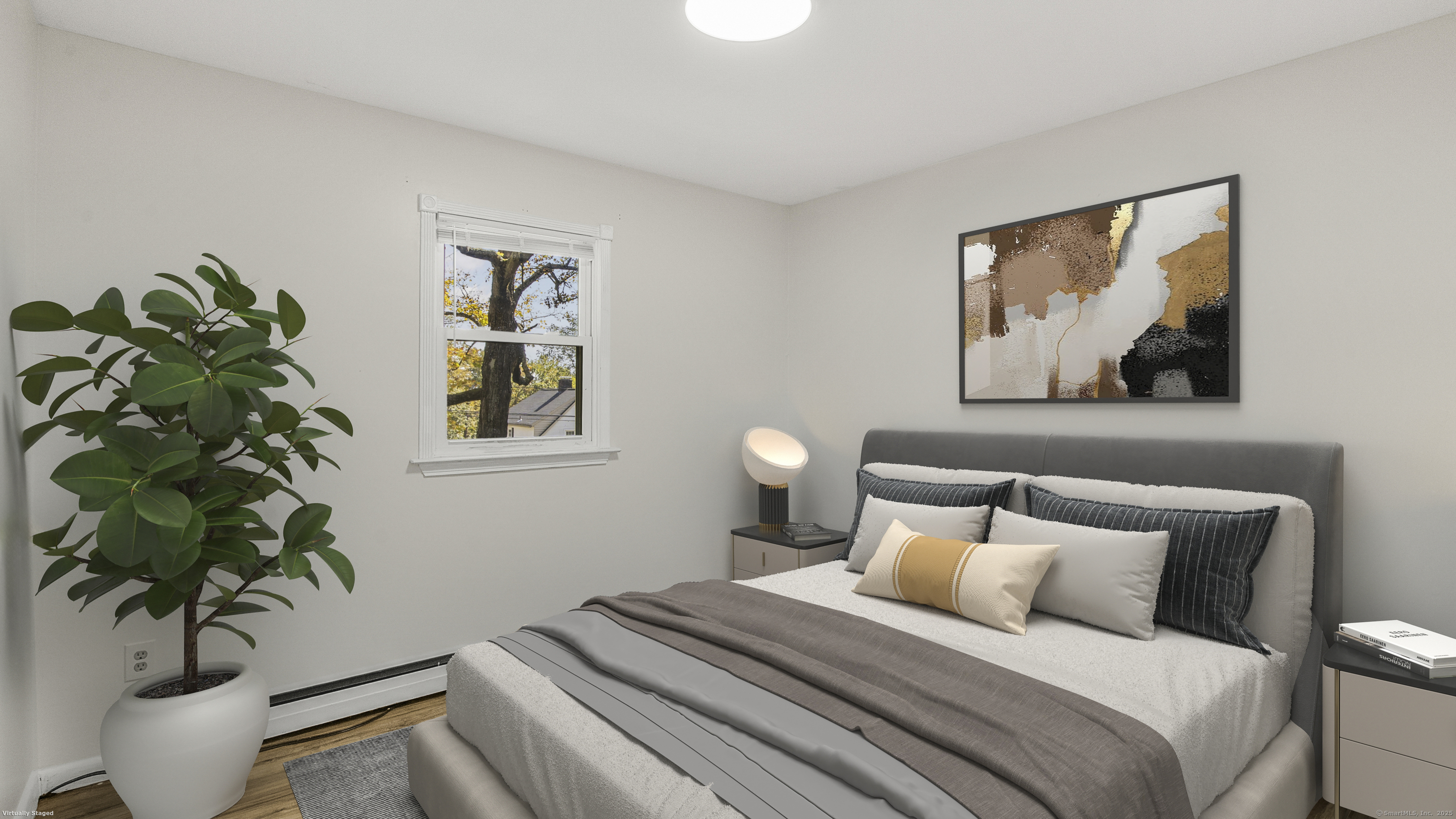 739 Field Street Naugatuck, CT 06770 - Photo 9 of 14 a bedroom with a bed and a potted plant