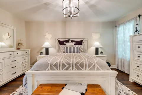 a bedroom with a bed and a dresser