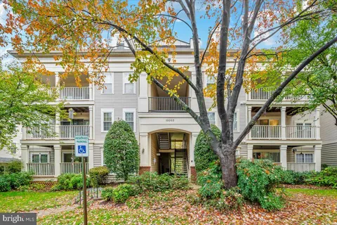 a spacious bedroom with a bed and a window