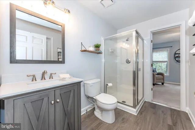 a bathroom with a toilet sink a shower and