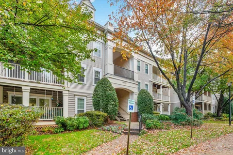 a view of a cars parked in front of a house