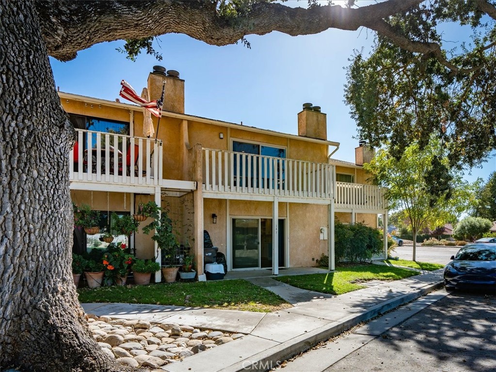 147 Flag Way, Unit 2 Paso Robles, CA 93446 - Photo 1 of 1 a front view of a house with garden