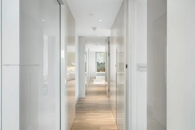 a bathroom with a glass shower door