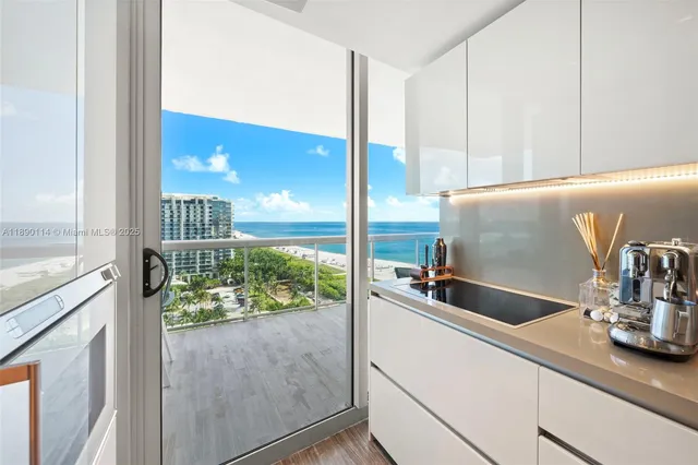 a kitchen with a sink and a large window