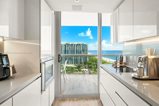 a kitchen with a sink and a refrigerator