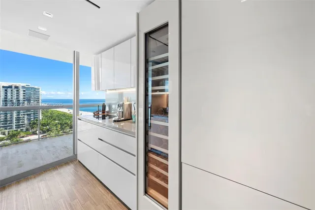 a kitchen with kitchen island a counter top space and stainless steel appliances
