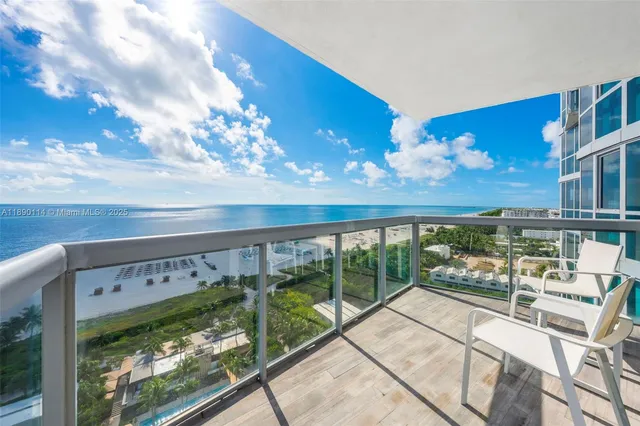 a view of balcony with two chairs