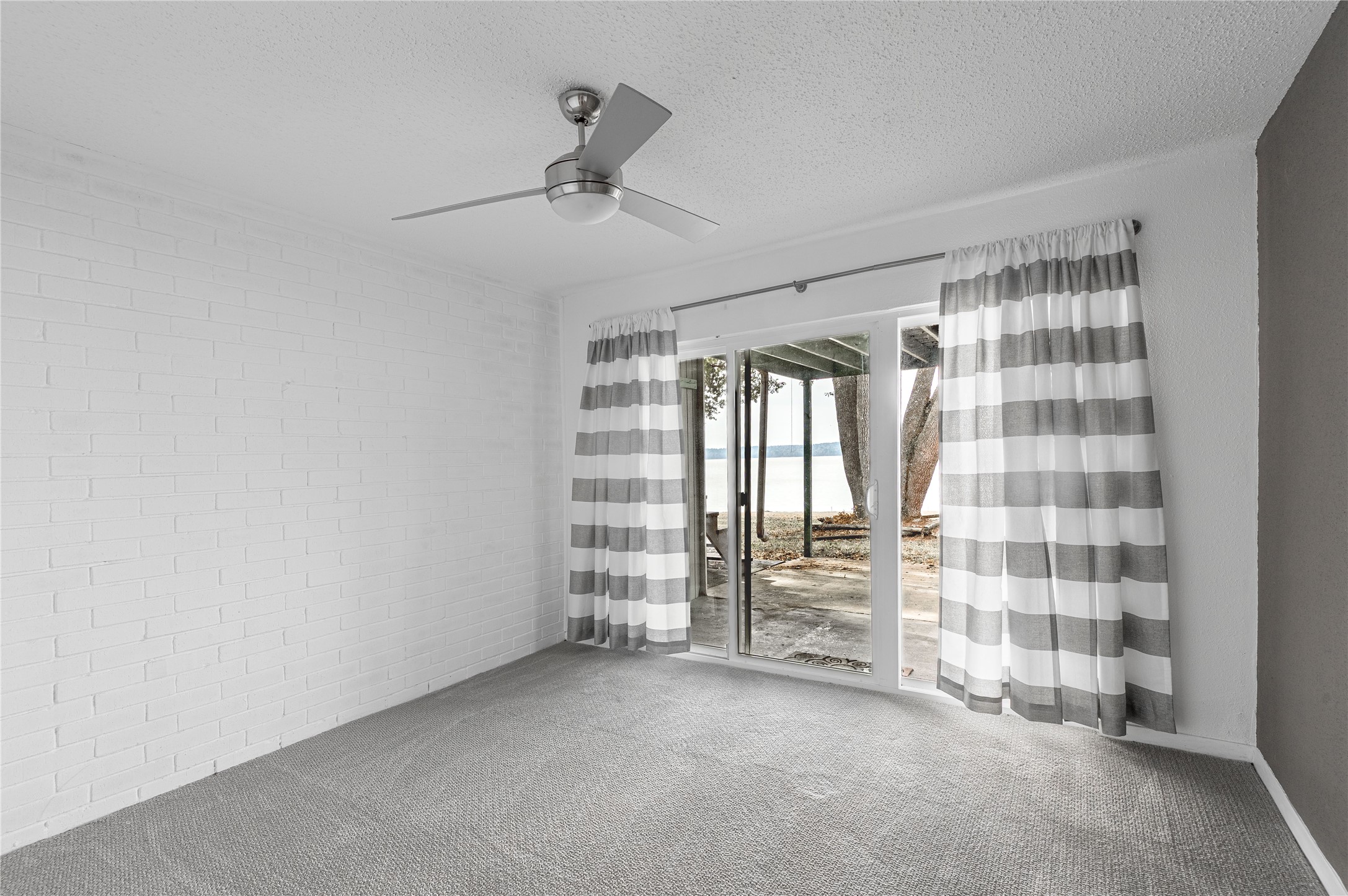 356 Peach Island Road Trinity, TX 75862 - Photo 18 of 34 a view of an empty room with a window