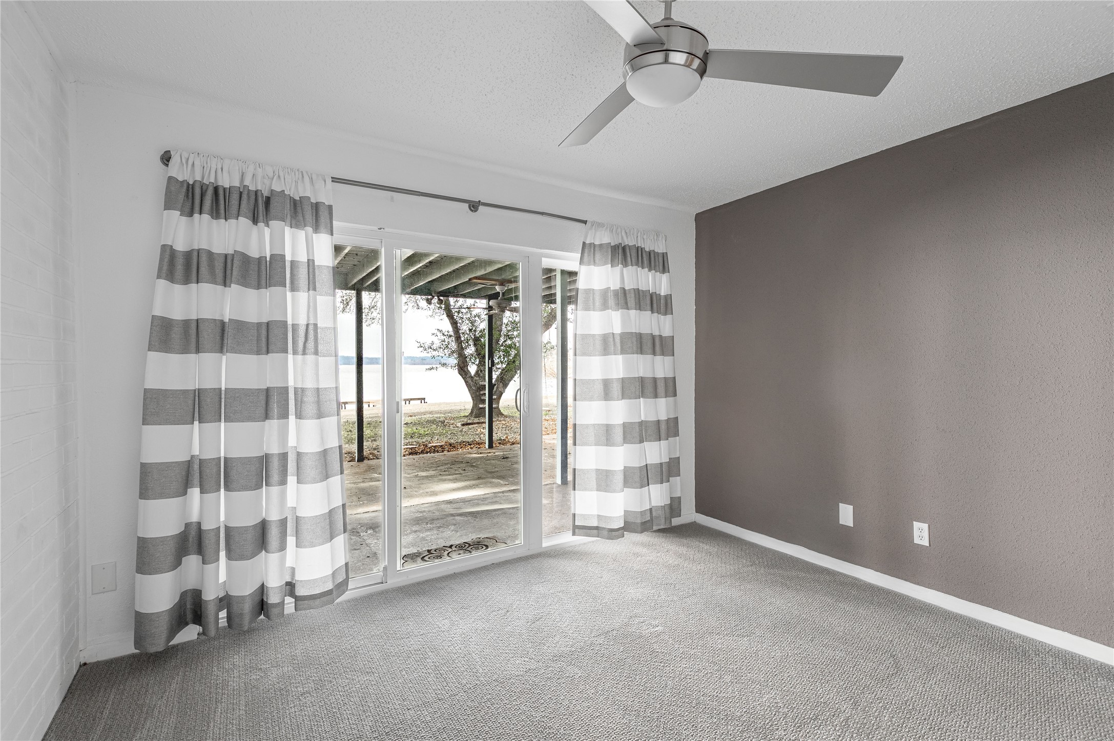 356 Peach Island Road Trinity, TX 75862 - Photo 19 of 34 a view of an empty room with a window