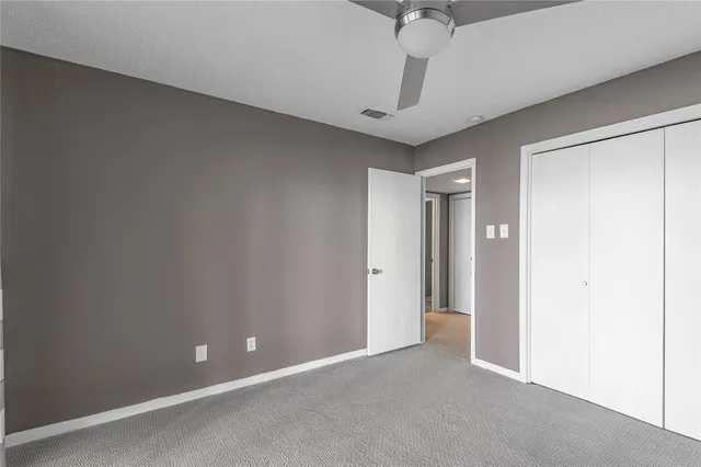 a view of an empty room with a chandelier