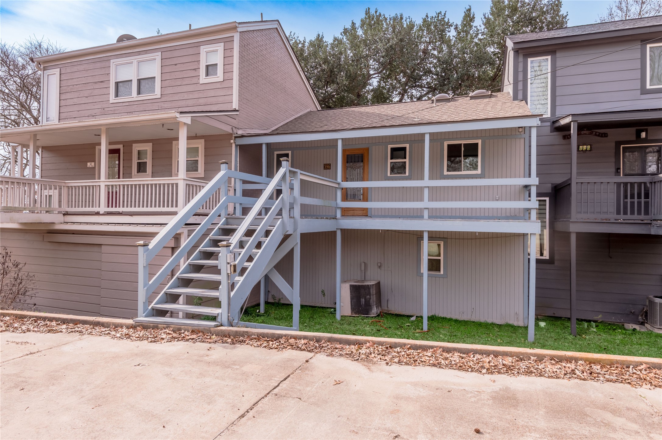 356 Peach Island Road Trinity, TX 75862 - Photo 2 of 34 a front view of a house with a yard and garage