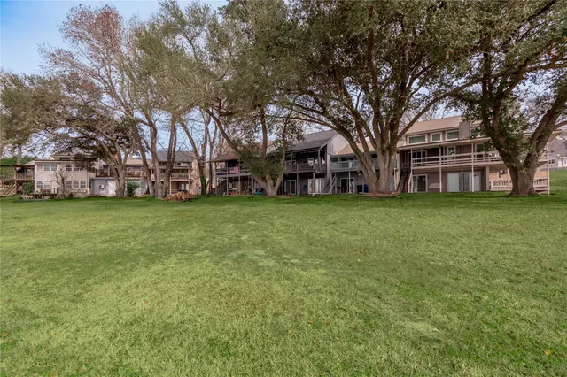 a view of a building with a large tree