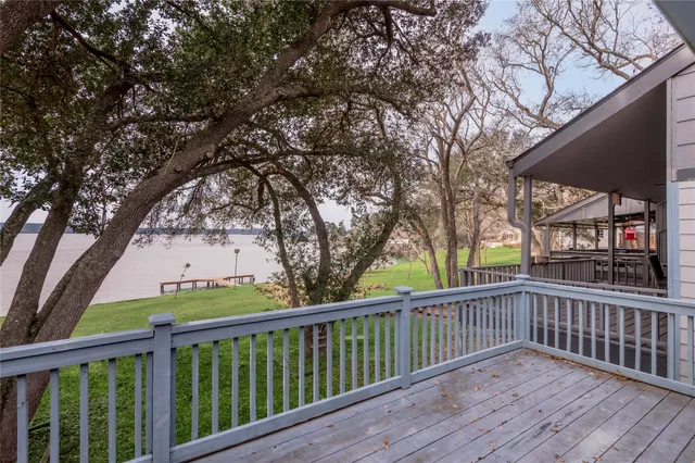 a view of a balcony with wooden floor