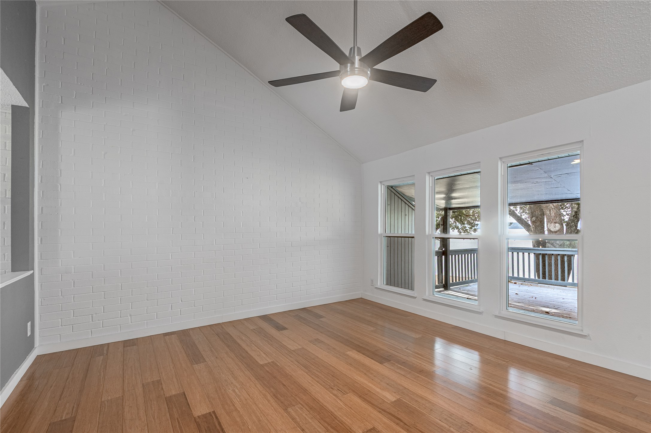 356 Peach Island Road Trinity, TX 75862 - Photo 10 of 34 wooden floor in an empty room with a window