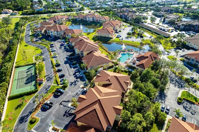 an aerial view of residential house with outdoor space and swimming pool