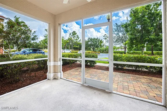 a view of backyard with green space and porch