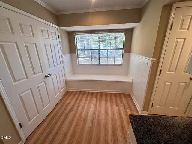 a view of a room with wooden floor and staircase