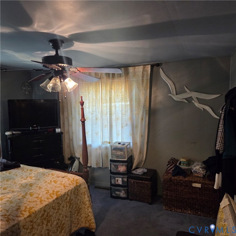 3065 Chickahominy Road Toano, VA 23168 - Photo 4 of 15 a bedroom with a bed and a mirror