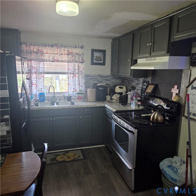 3065 Chickahominy Road Toano, VA 23168 - Photo 7 of 15 a kitchen with a sink appliances and cabinets
