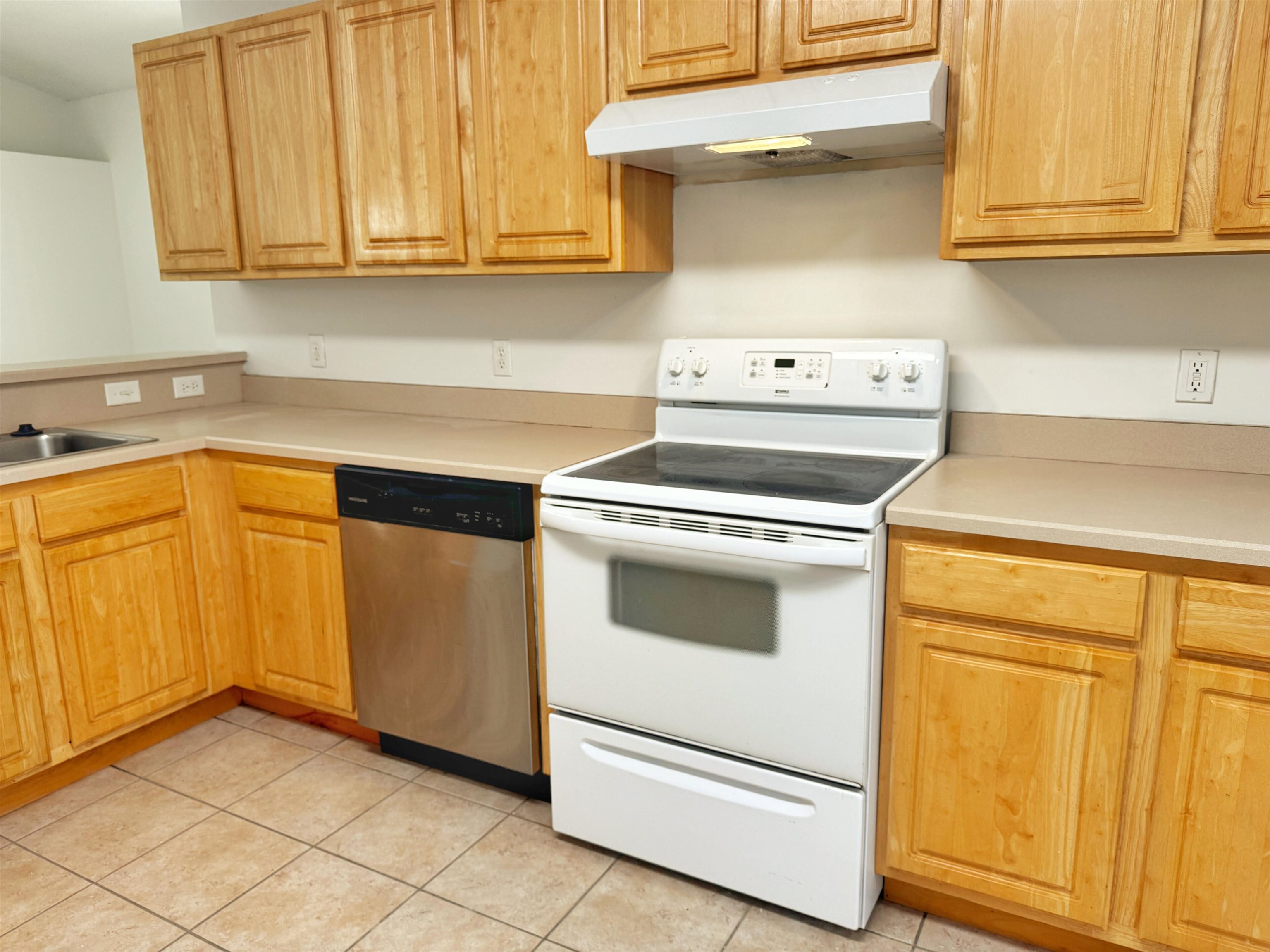 632 Segovia Road St. Augustine, FL 32086 - Photo 13 of 28 a kitchen with granite countertop white cabinets and white appliances
