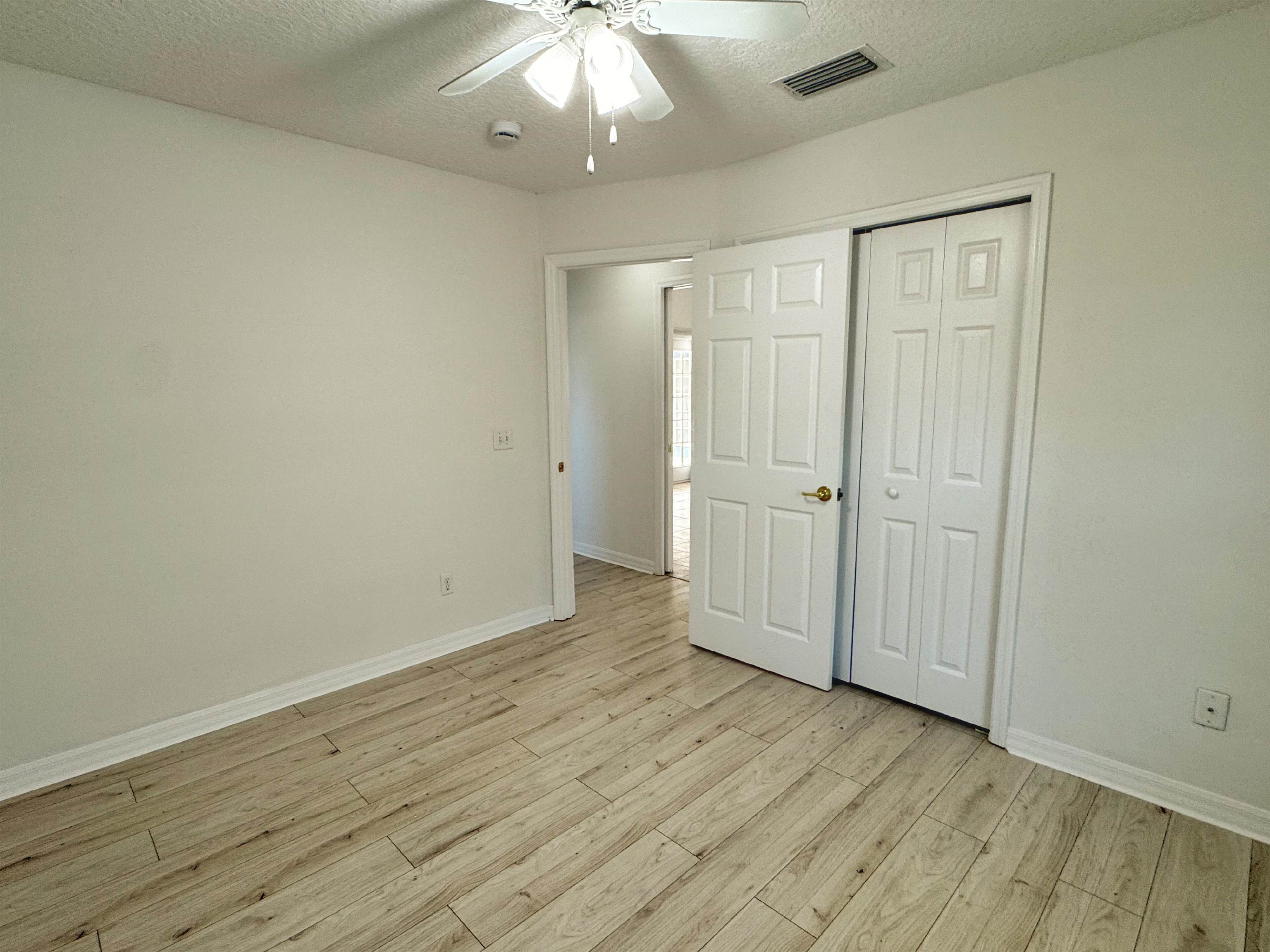 632 Segovia Road St. Augustine, FL 32086 - Photo 21 of 28 a view of an empty room with wooden floor