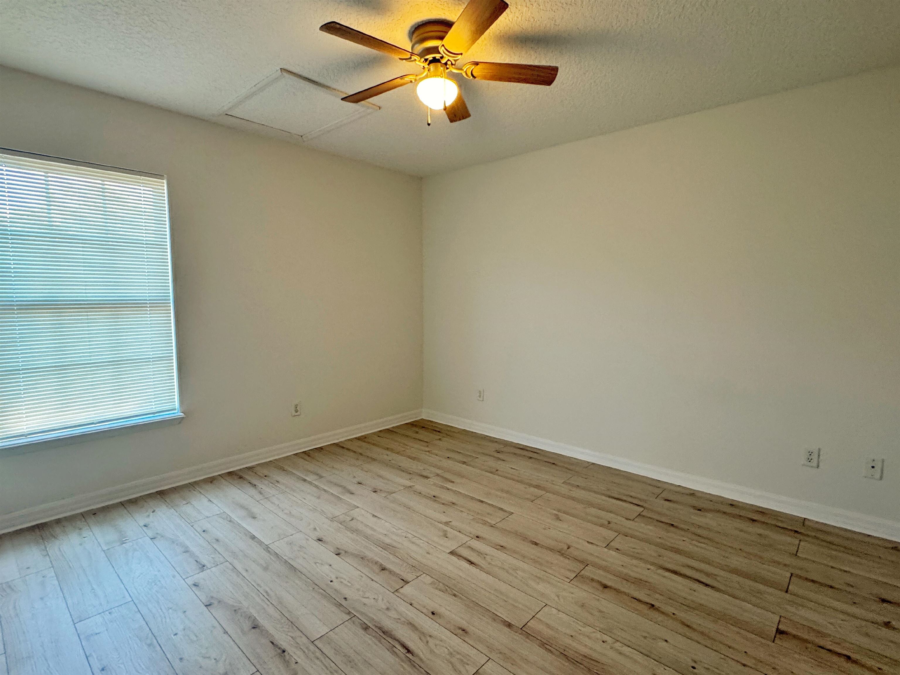 632 Segovia Road St. Augustine, FL 32086 - Photo 23 of 28 wooden floor in an empty room with a window