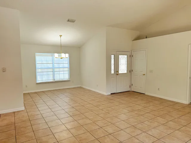 a view of a kitchen with a sink cabinets and a window