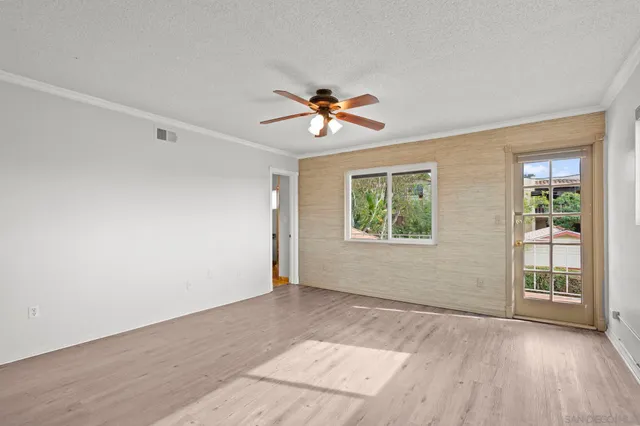 a view of a balcony with yard