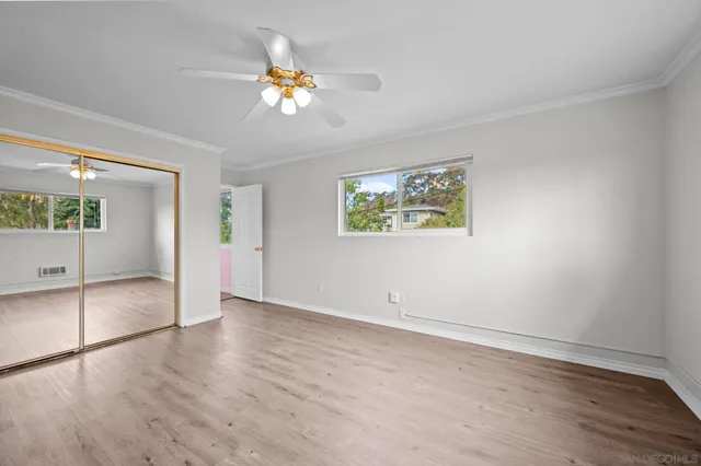 a view of a room that has a large window