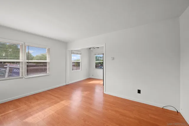 a kitchen with a refrigerator and a sink