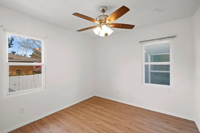 an aerial view of multiple houses with yard