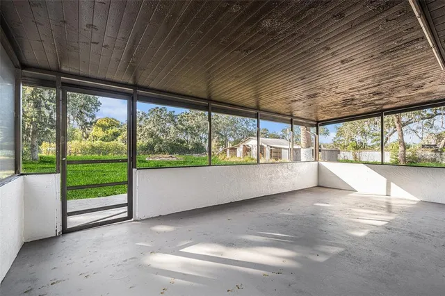 a view of an empty room with a large window