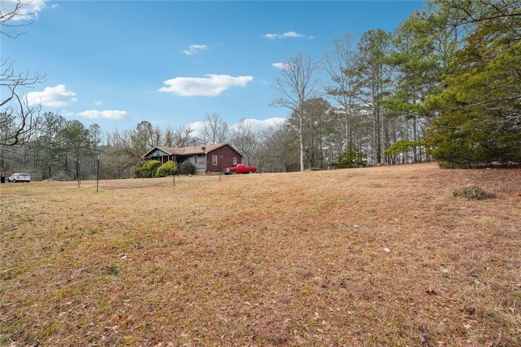 8265 Seabolt Drive Ball Ground, GA 30107 - Photo 19 of 52 a view of a field and trees