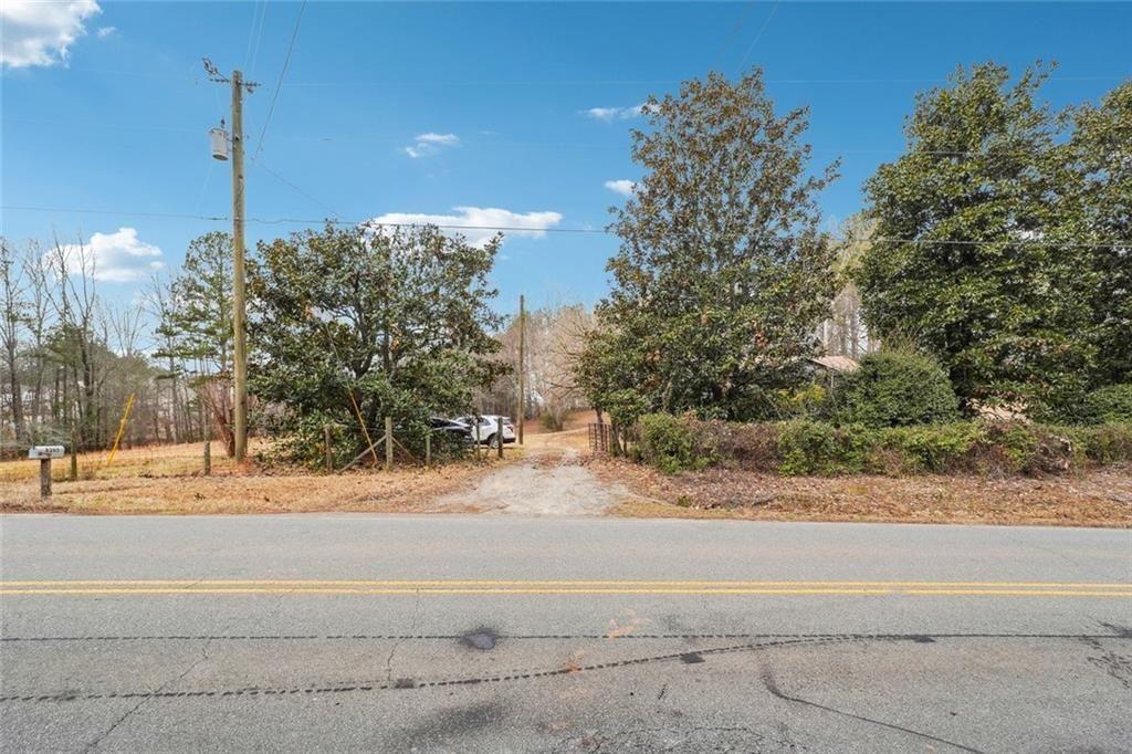 8265 Seabolt Drive Ball Ground, GA 30107 - Photo 25 of 52 a view of a road with a building in the background