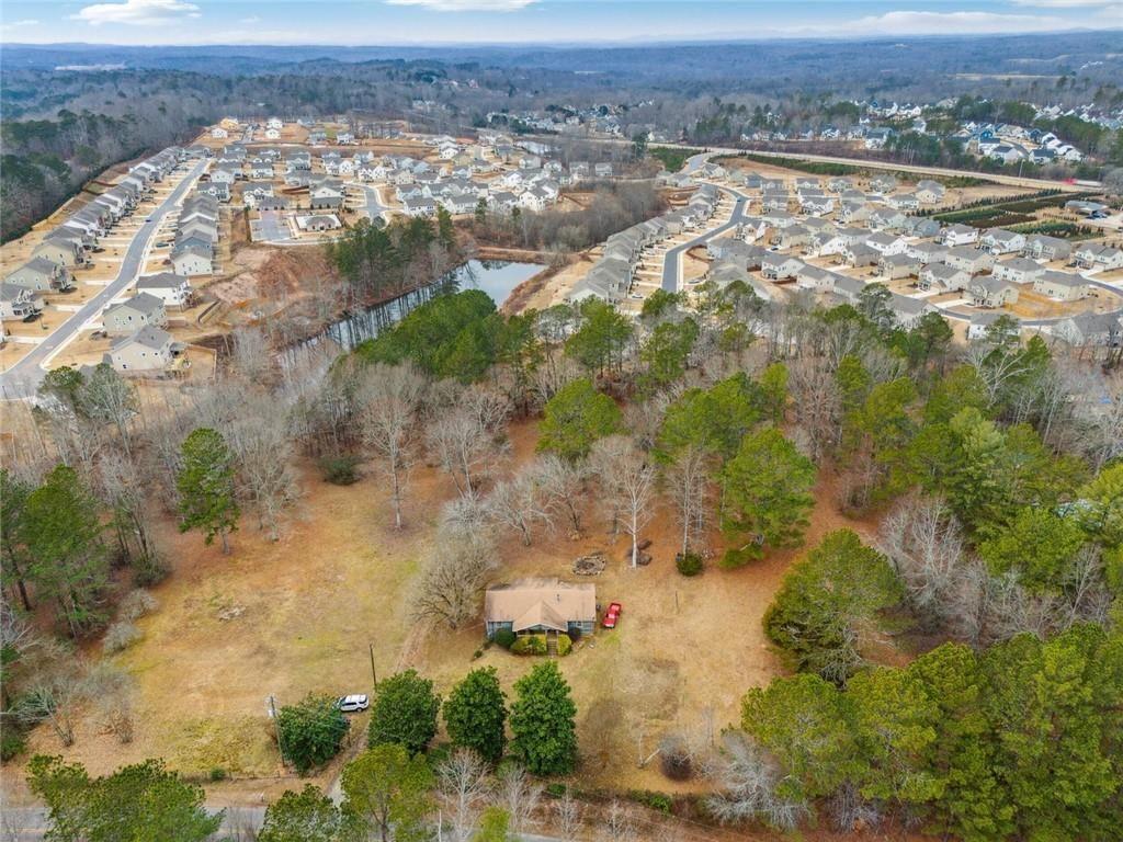 8265 Seabolt Drive Ball Ground, GA 30107 - Photo 33 of 52 an aerial view of residential houses with outdoor space