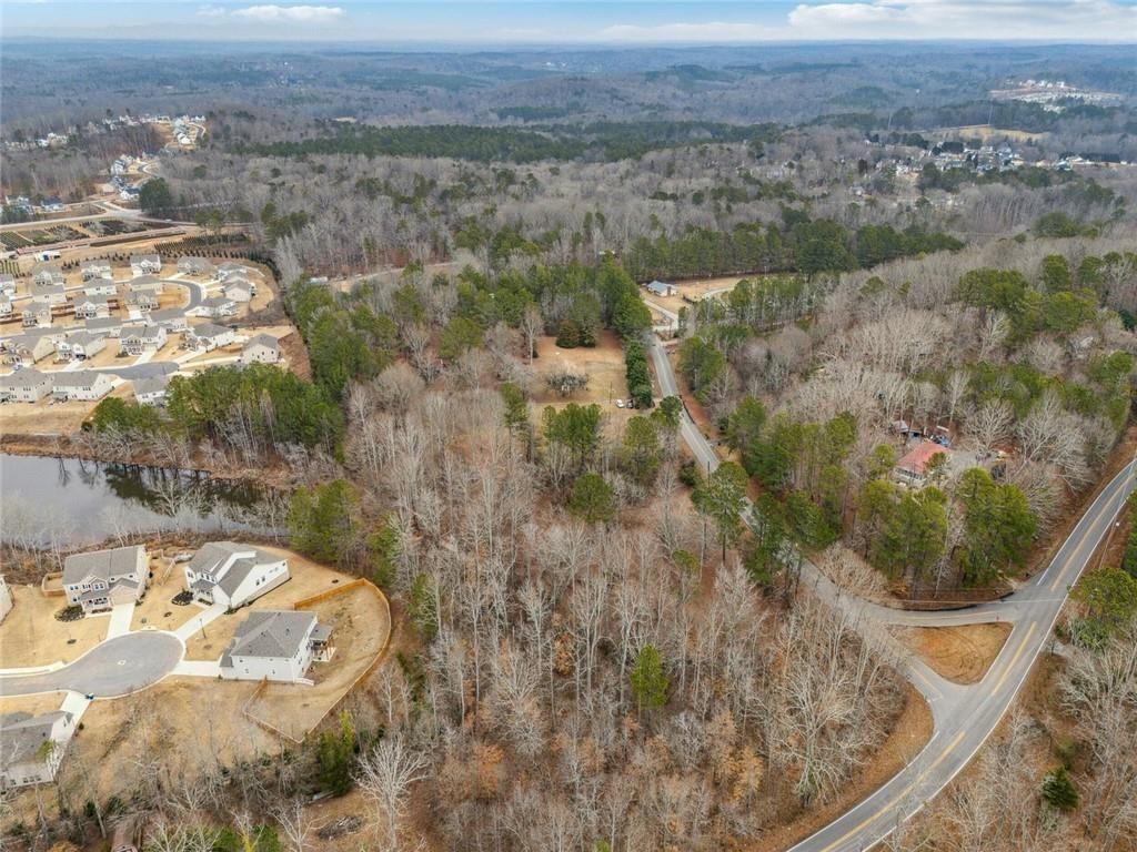 8265 Seabolt Drive Ball Ground, GA 30107 - Photo 36 of 52 a view of a lake with a mountain
