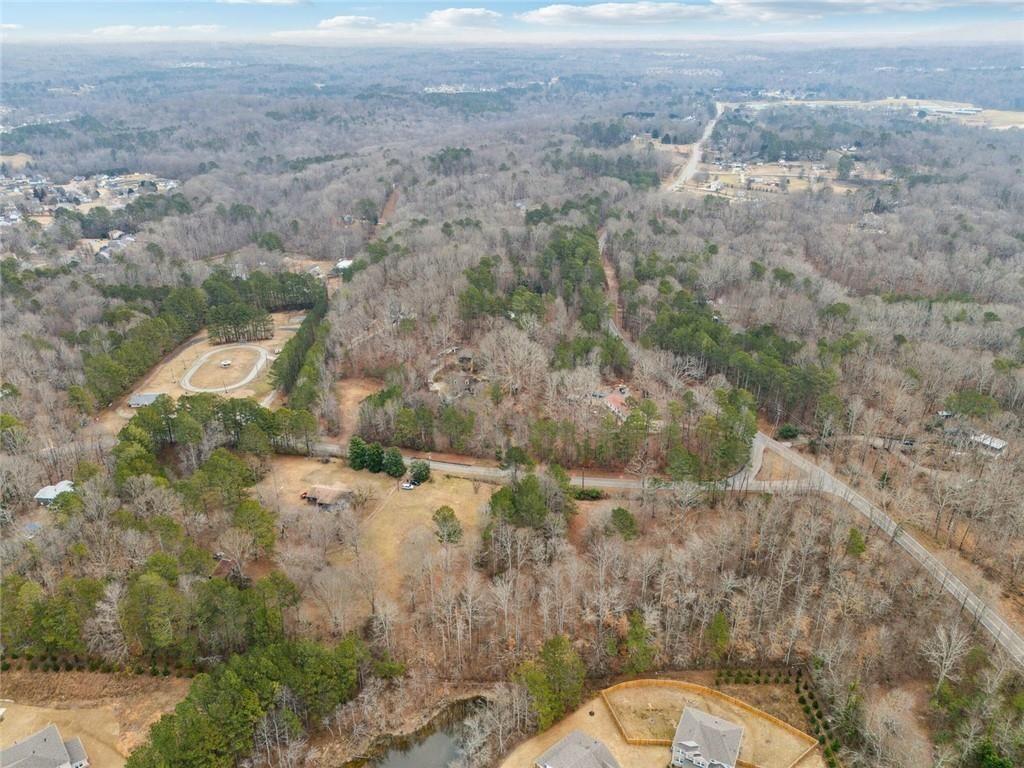 8265 Seabolt Drive Ball Ground, GA 30107 - Photo 38 of 52 an aerial view of a house with a yard