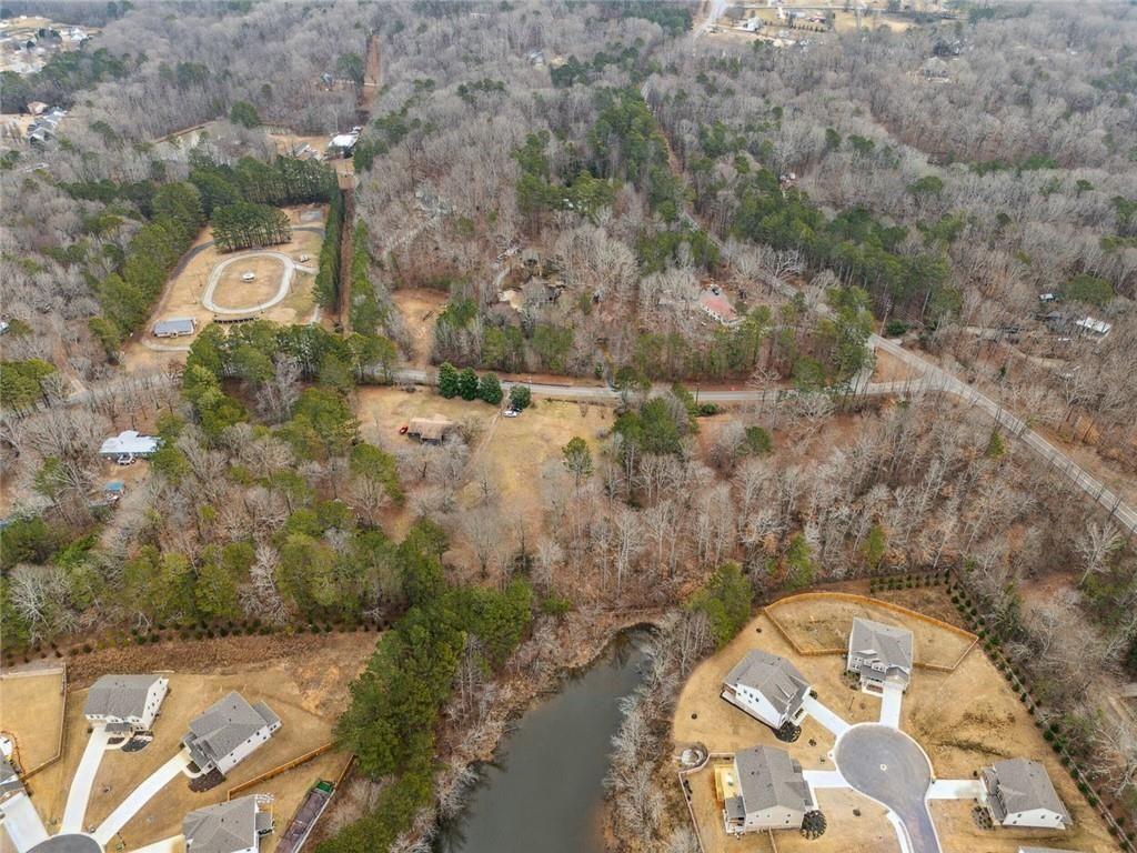 8265 Seabolt Drive Ball Ground, GA 30107 - Photo 39 of 52 a view of a brick wall with a building in the background