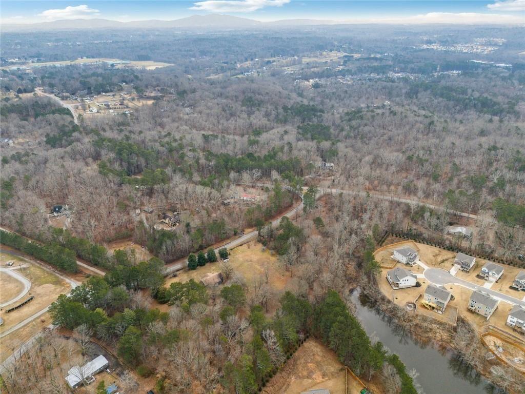 8265 Seabolt Drive Ball Ground, GA 30107 - Photo 40 of 52 an aerial view of a house with a yard